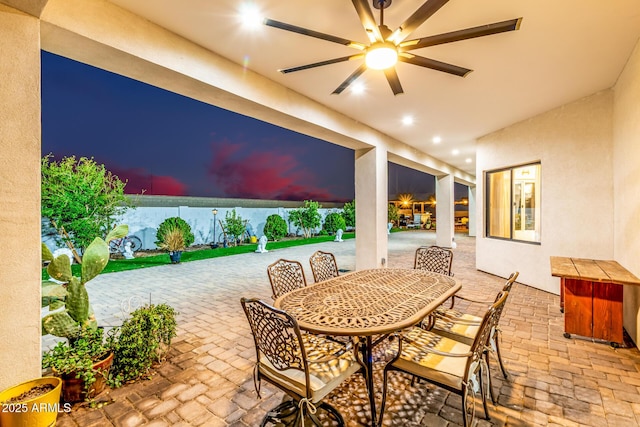 view of patio / terrace featuring outdoor dining space and a ceiling fan