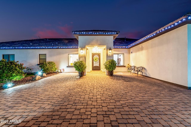 exterior space featuring stucco siding