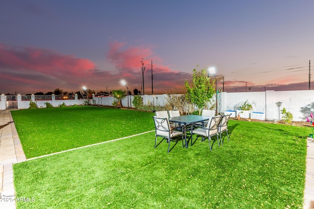 view of yard with a fenced backyard