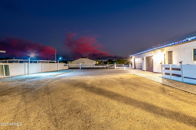 view of yard with a garage and fence