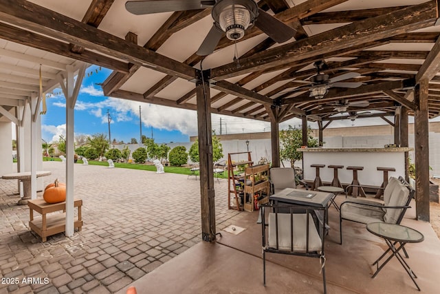 view of patio / terrace featuring a gazebo and outdoor dry bar