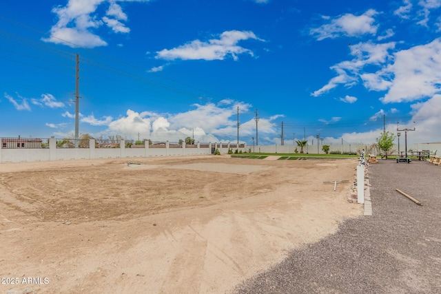 view of property's community featuring fence