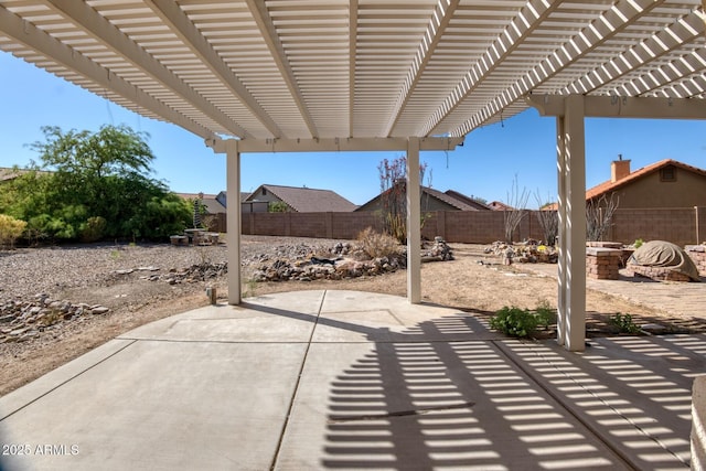 view of patio / terrace with an outdoor fire pit, a pergola, and a fenced backyard