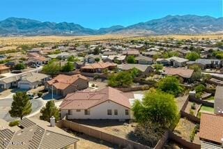aerial view featuring a mountain view and a residential view