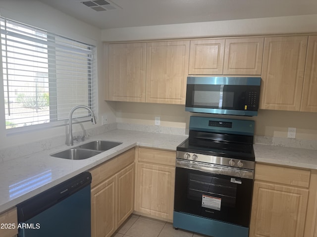 7575 E Indian Bend Rd Unit 1100, Scottsdale, AZ 85250 - kitchen with appliances with stainless steel finishes, light brown cabinets, and a sink