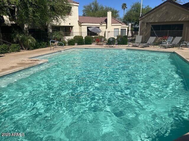 7575 E Indian Bend Rd Unit 1100, Scottsdale, AZ 85250 - community pool with fence and a patio area