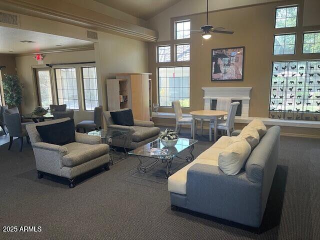 7575 E Indian Bend Rd Unit 1100, Scottsdale, AZ 85250 - carpeted living room featuring a ceiling fan and high vaulted ceiling
