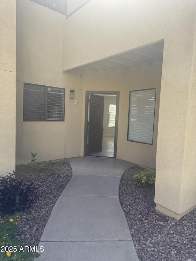 7575 E Indian Bend Rd Unit 1100, Scottsdale, AZ 85250 - view of exterior entry featuring stucco siding