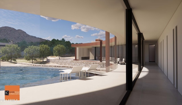 view of swimming pool featuring a mountain view and a patio