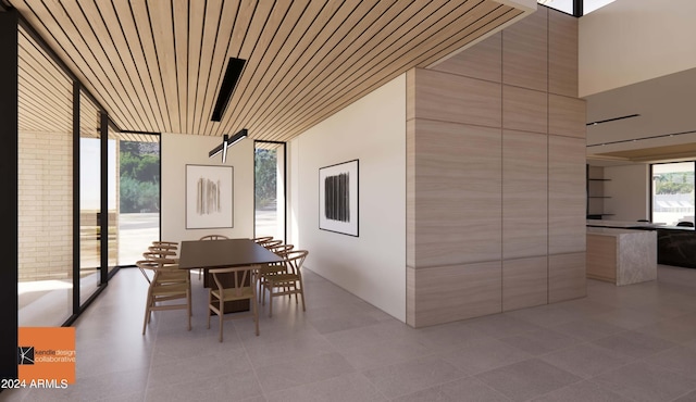 unfurnished dining area with expansive windows and wood ceiling