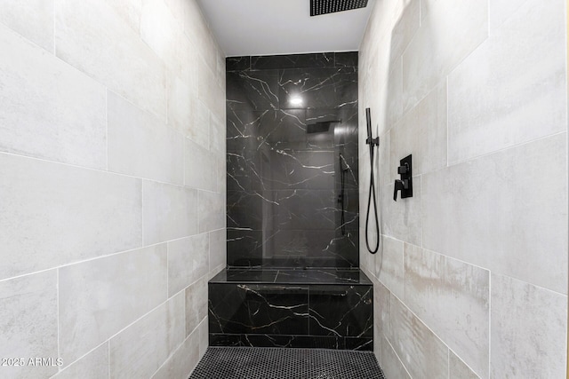 bathroom featuring tiled shower