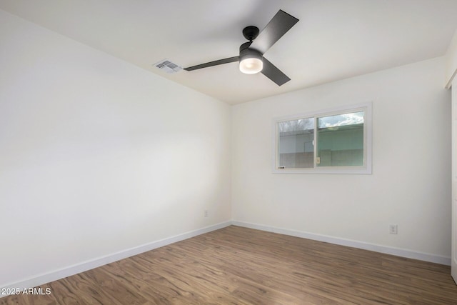 unfurnished room with hardwood / wood-style flooring and ceiling fan