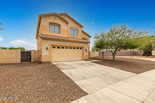 view of front of home with stucco siding, a gate, fence, concrete driveway, and an attached garage