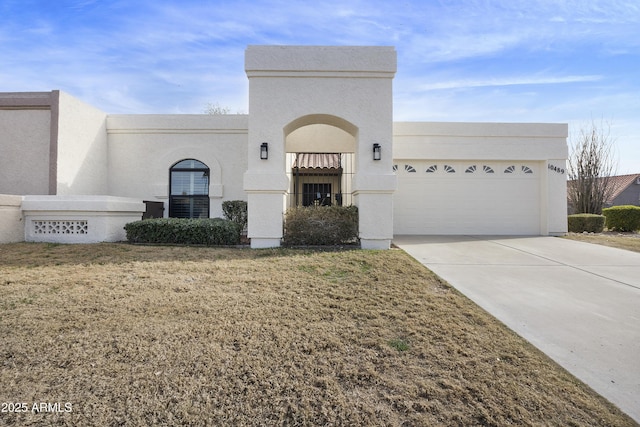 view of front of home with a garage and a front yard