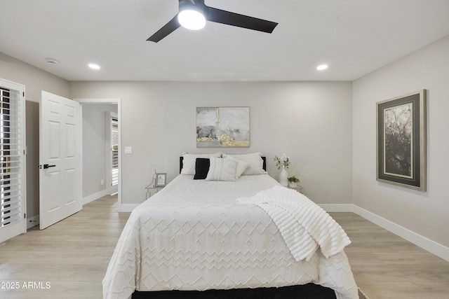 bedroom featuring light hardwood / wood-style flooring and ceiling fan