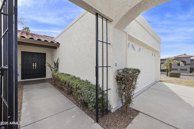 doorway to property featuring a garage