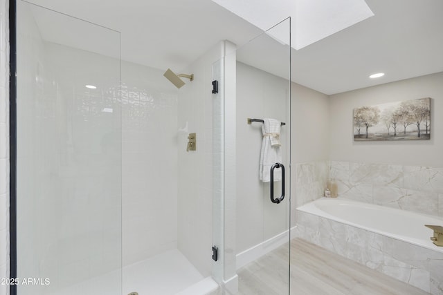 bathroom with shower with separate bathtub