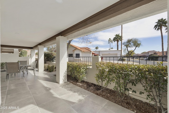 view of patio featuring a balcony