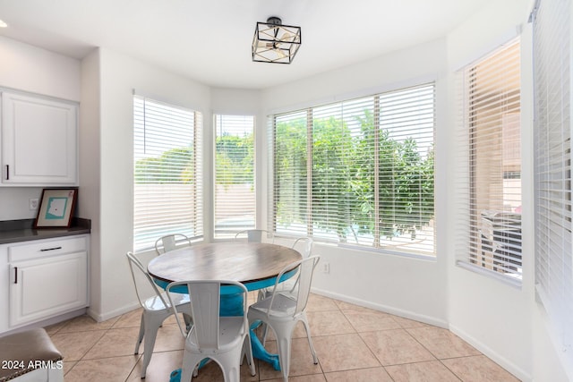 dining area featuring light tile patterned floors