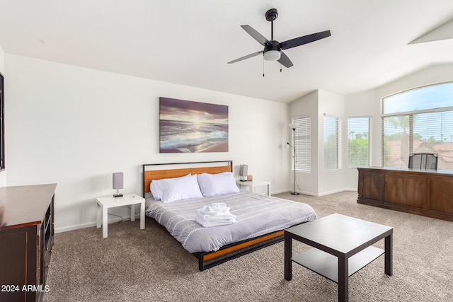 carpeted bedroom with vaulted ceiling and ceiling fan