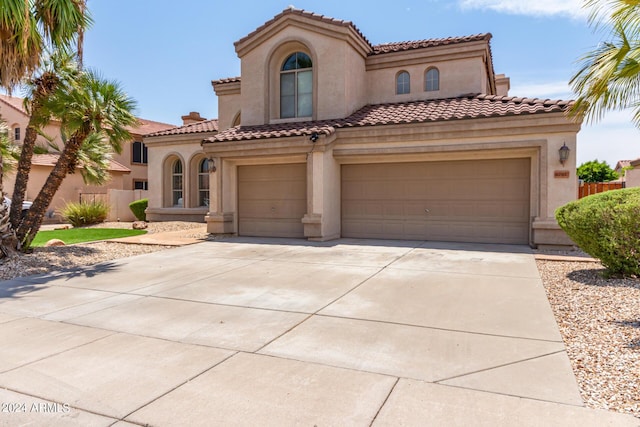 mediterranean / spanish-style home featuring a garage