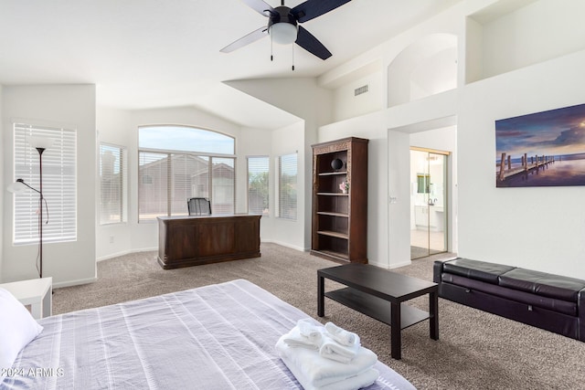 bedroom featuring ceiling fan, light colored carpet, lofted ceiling, and connected bathroom