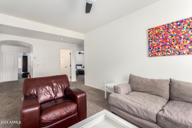 living room with ceiling fan and carpet flooring