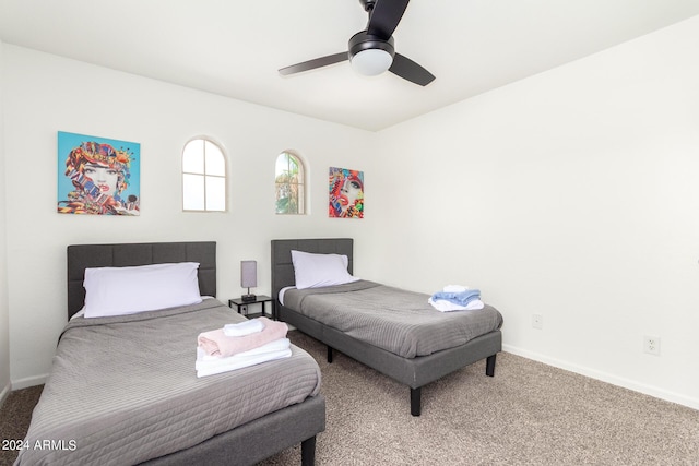 carpeted bedroom featuring ceiling fan