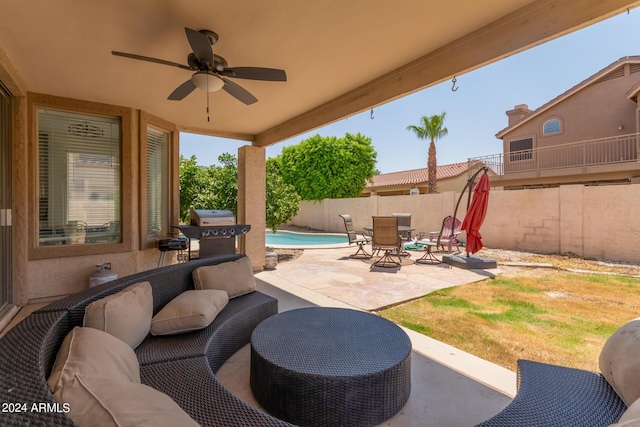 view of patio / terrace featuring a fenced in pool, grilling area, outdoor lounge area, and ceiling fan