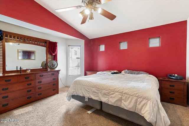 carpeted bedroom featuring lofted ceiling and ceiling fan