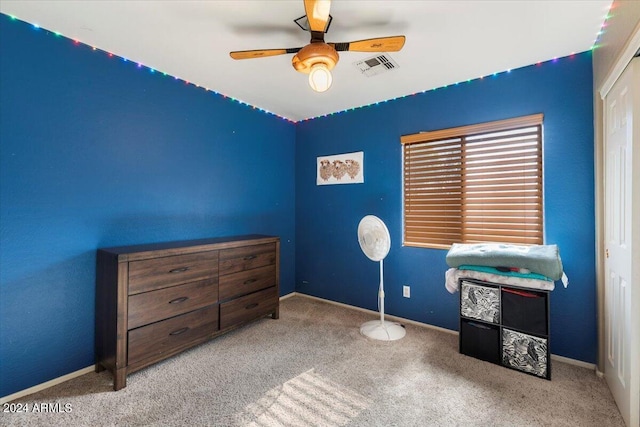 carpeted bedroom with ceiling fan