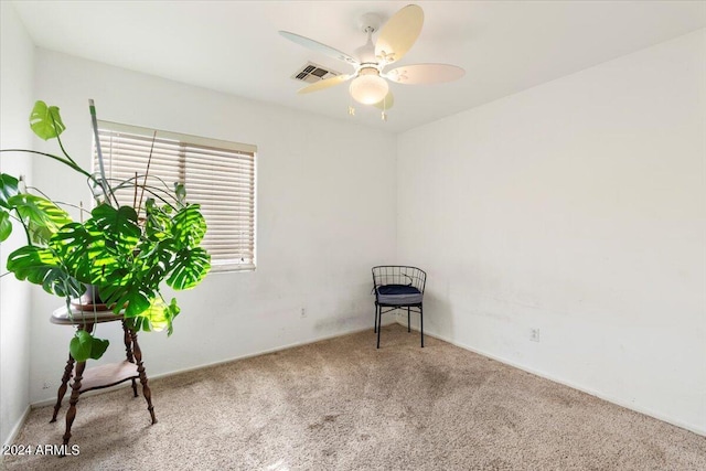 unfurnished room featuring ceiling fan and carpet flooring