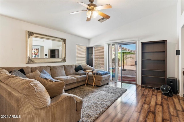 living room featuring ceiling fan, lofted ceiling, and dark hardwood / wood-style floors