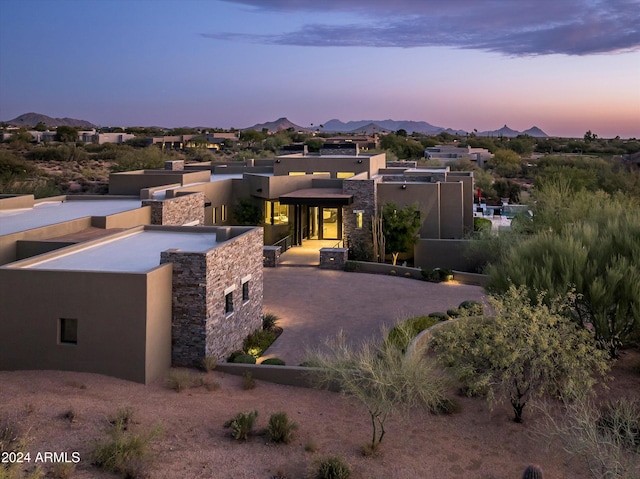 view of front of home featuring a mountain view