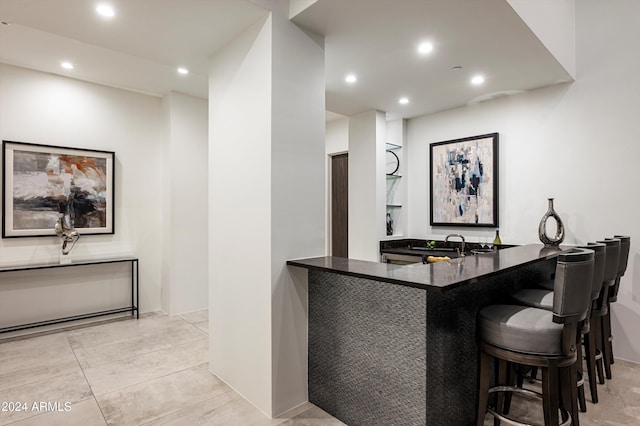 bar featuring light tile patterned flooring