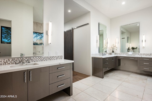 bathroom featuring decorative backsplash, vanity, and tile patterned floors