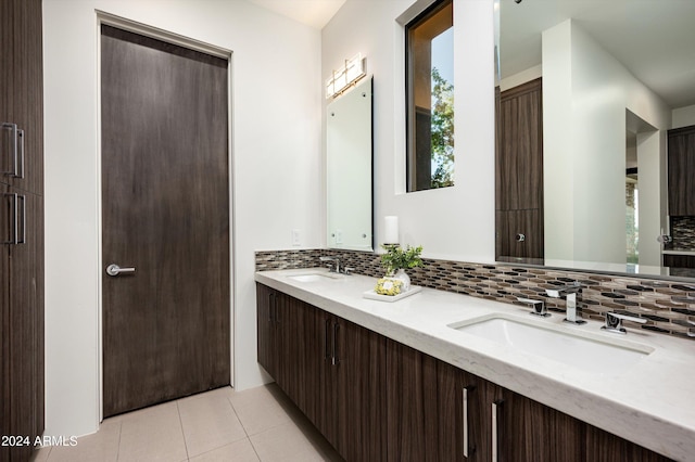 bathroom with vanity, backsplash, and tile patterned floors