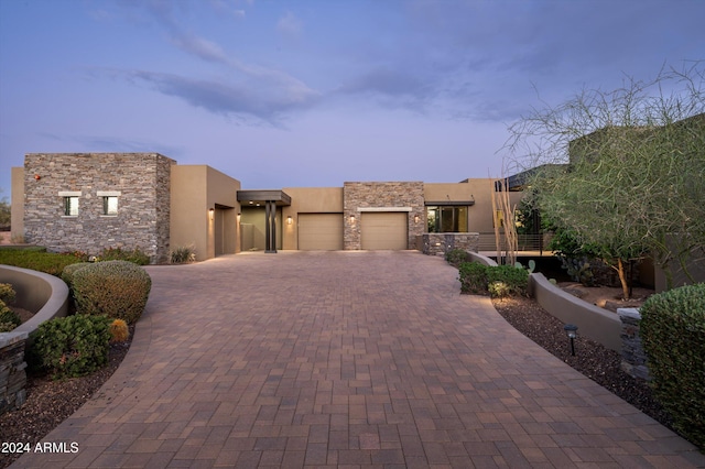 adobe home featuring a garage