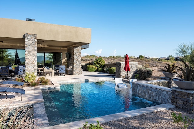 view of pool with a patio area