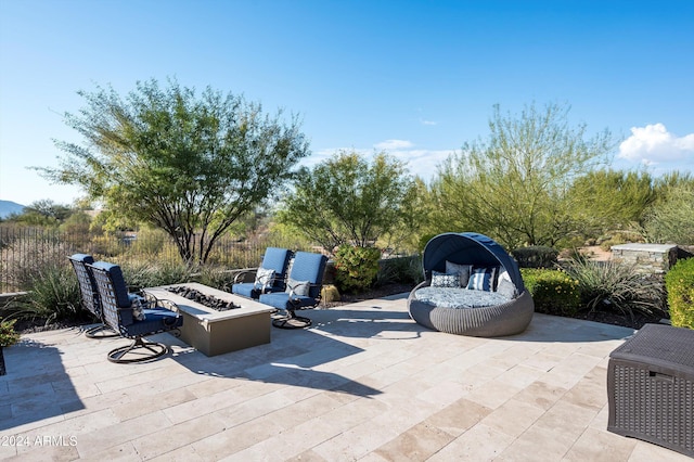 view of patio / terrace featuring an outdoor fire pit