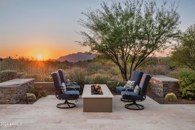 patio terrace at dusk with a fire pit