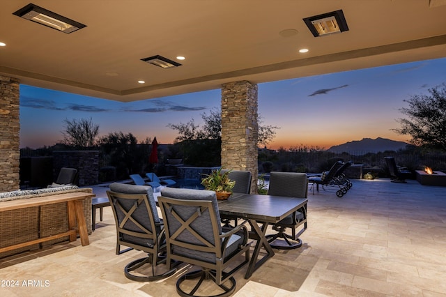 patio terrace at dusk with a mountain view