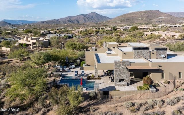 birds eye view of property with a mountain view