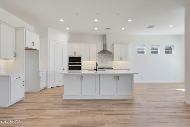 28266 N 134th Dr, Peoria, AZ 85383 - kitchen featuring visible vents, wall chimney exhaust hood, white cabinets, and light countertops