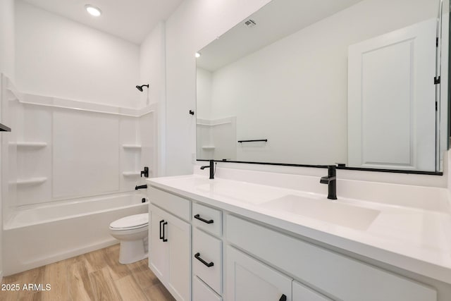 28266 N 134th Dr, Peoria, AZ 85383 - full bathroom with toilet, a sink, wood finished floors, shower / bathing tub combination, and double vanity