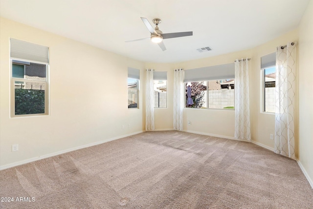 empty room featuring carpet and ceiling fan