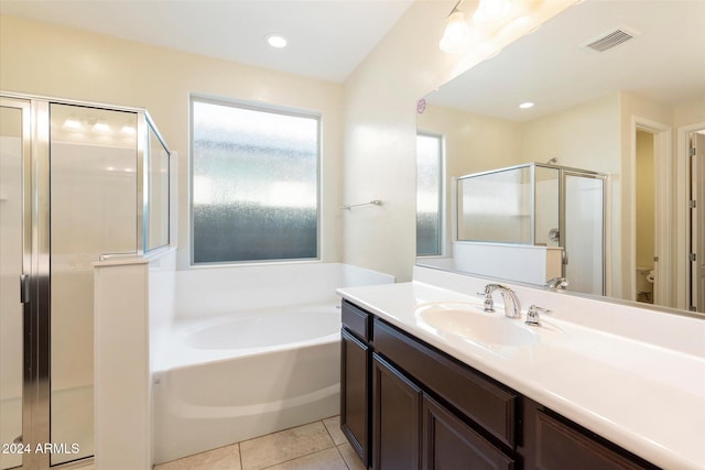 full bathroom featuring toilet, tile patterned flooring, vanity, and shower with separate bathtub