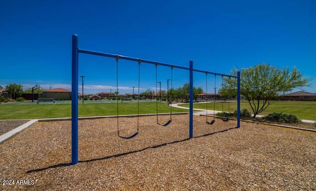 view of jungle gym featuring a yard