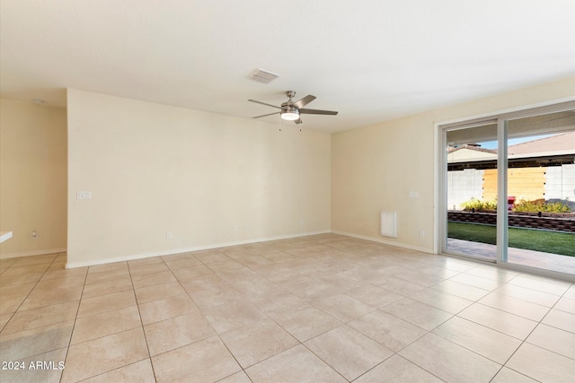 unfurnished room featuring ceiling fan and light tile patterned floors