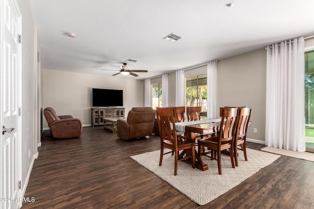 dining room featuring dark hardwood / wood-style floors and ceiling fan